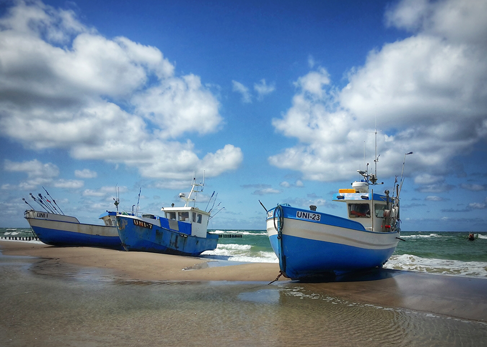 Boats on a beach when the tide is out
