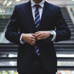 Man adjusting his tie